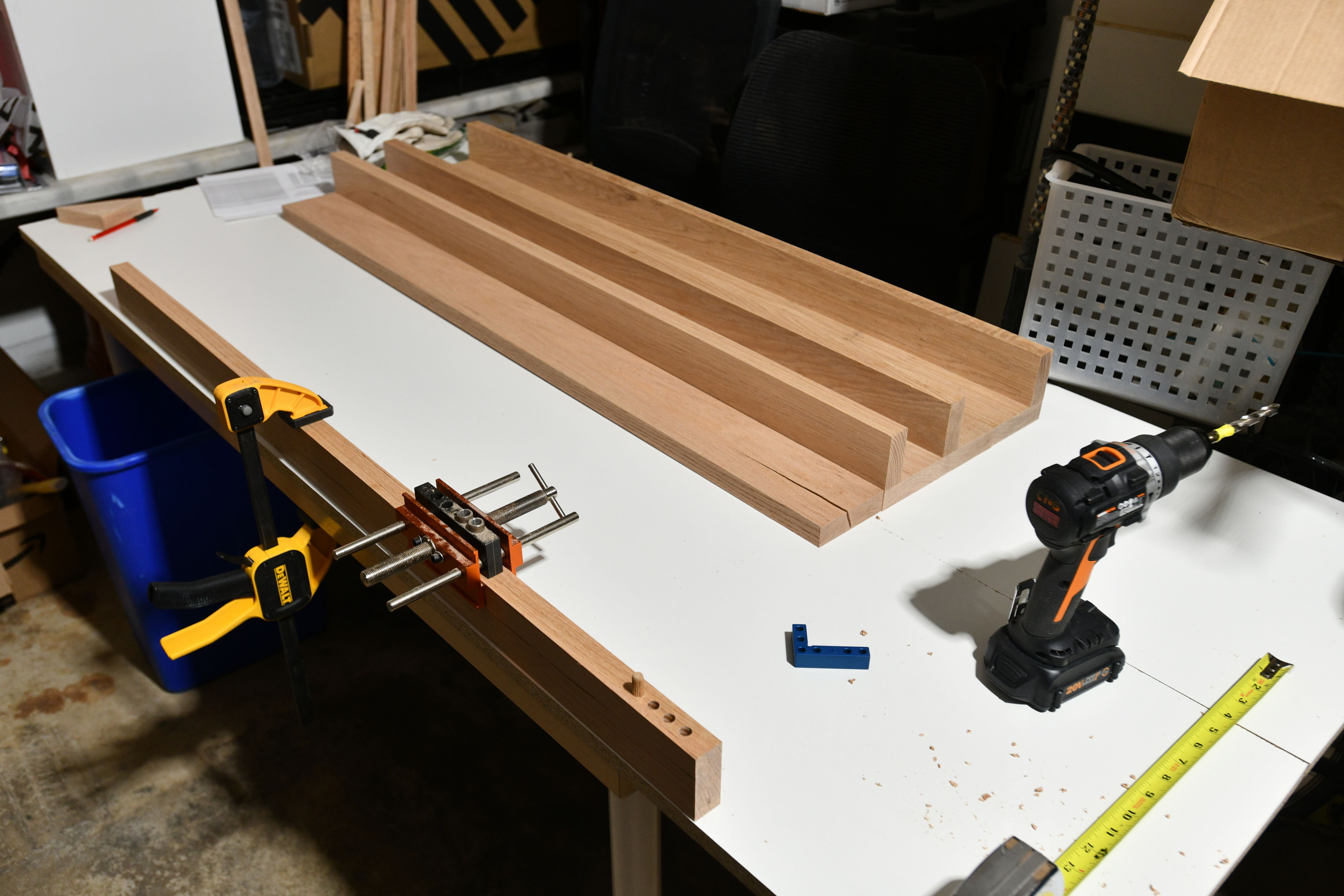 I switched from my original idea of using 4 inch square posts as legs to using two boards joined at a right angle. I decided to use dowels and glue to join these. It was my first time cutting dowel holes, and using a doweling jig.