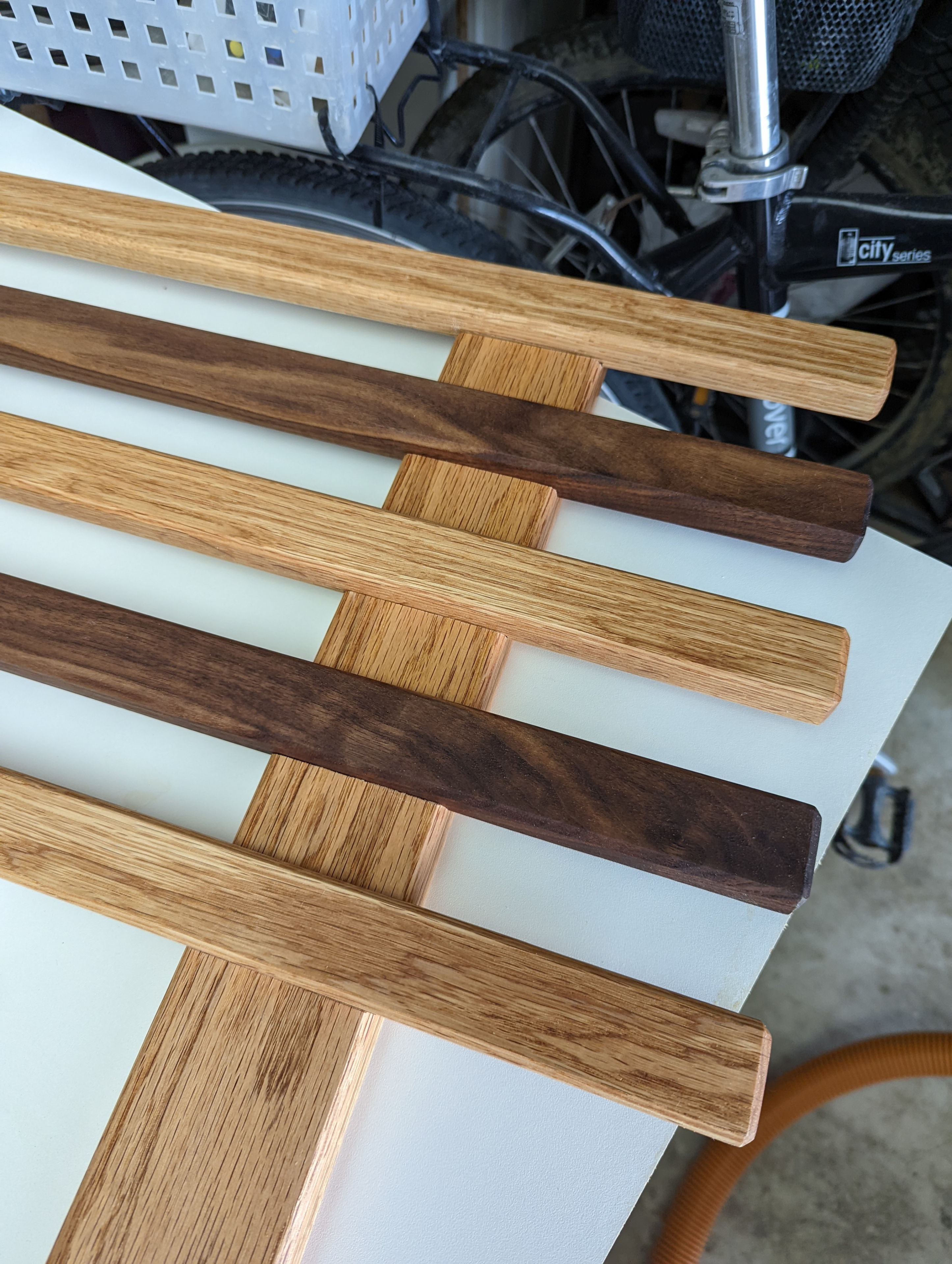 I built the headboard out of a grid of boards with interlocking recesses cut using a cross cut sled and many shallow passes on the table saw, then glued together. This ended up looking much better than my original plan to simply screw them together.