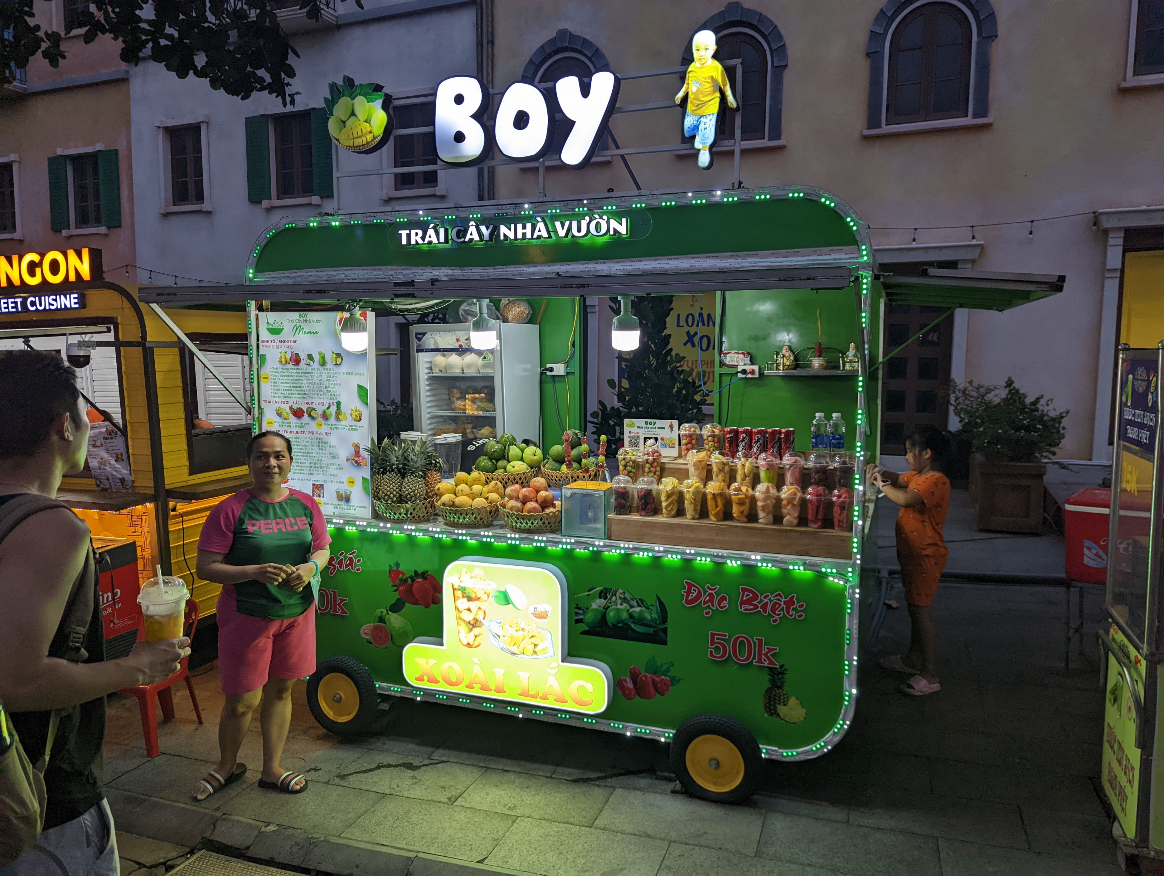 We got some fresh fruit juice at this vendor called "Boy". The lady said it was named after her child. Sunset Town, Phu Quoc, Vietnam.