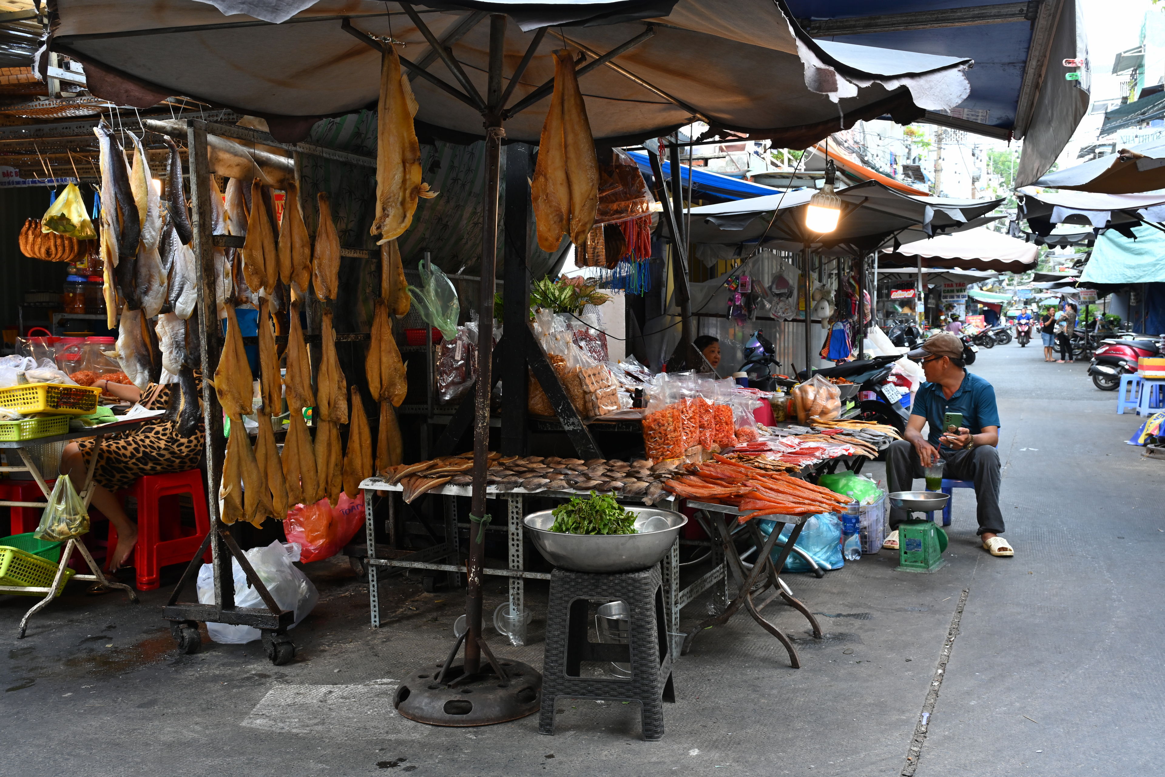 Exploring and getting food at Ho Thi Ky Flower Market, Chợ hoa Hồ Thị Kỷ, in Saigon, Vietnam.