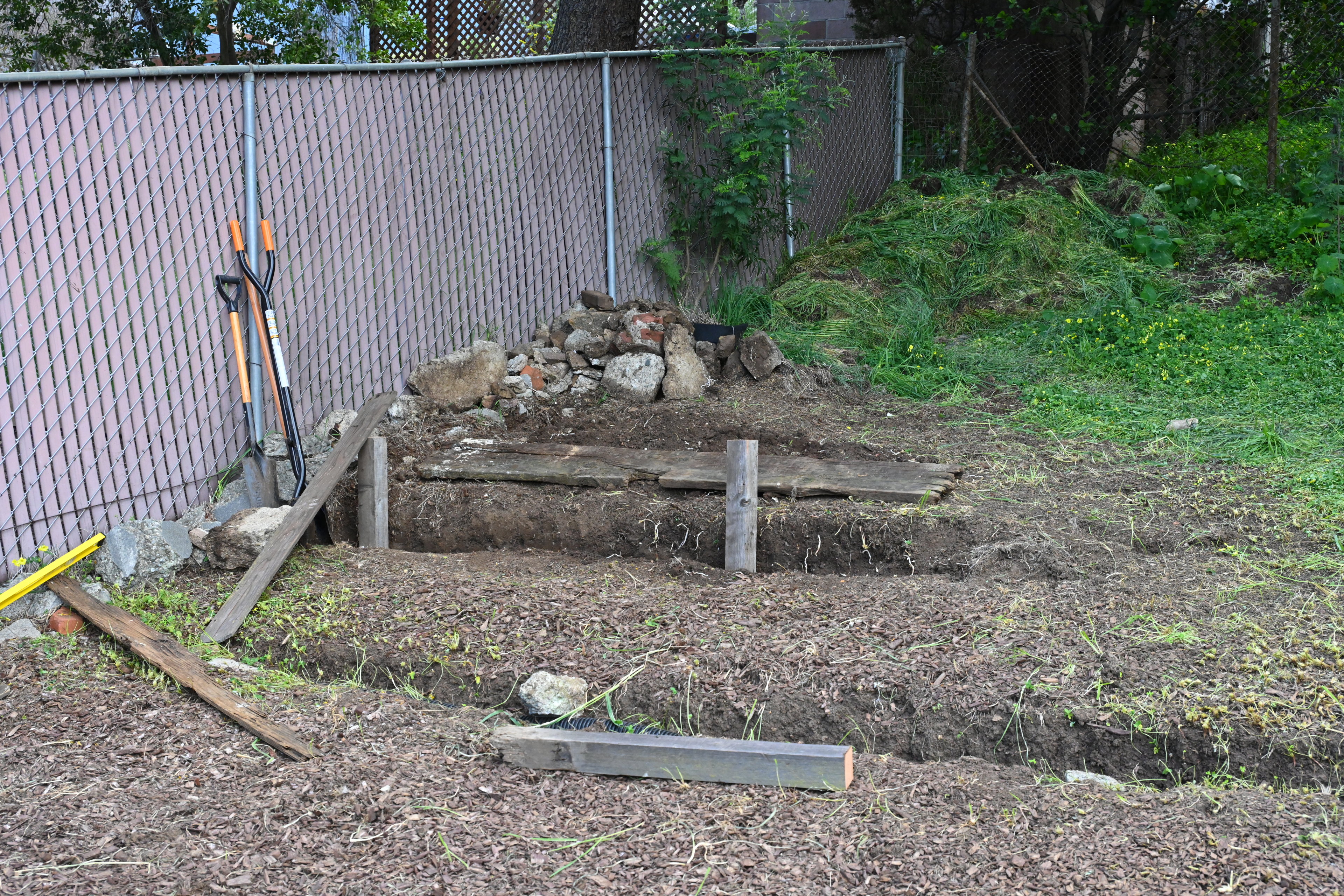 Raised garden bed build in progress.