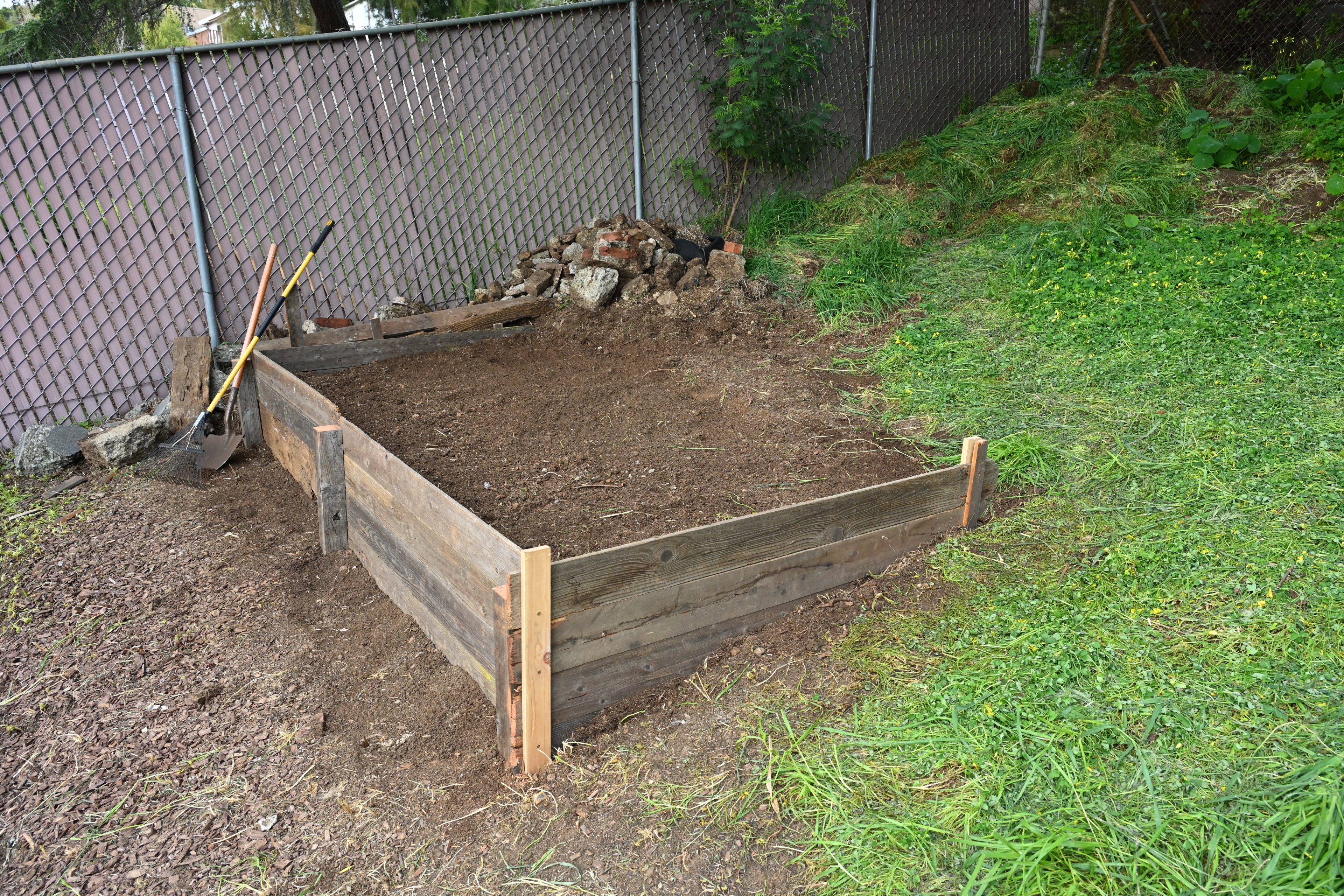Completed first raised bed using mostly salvaged wood.