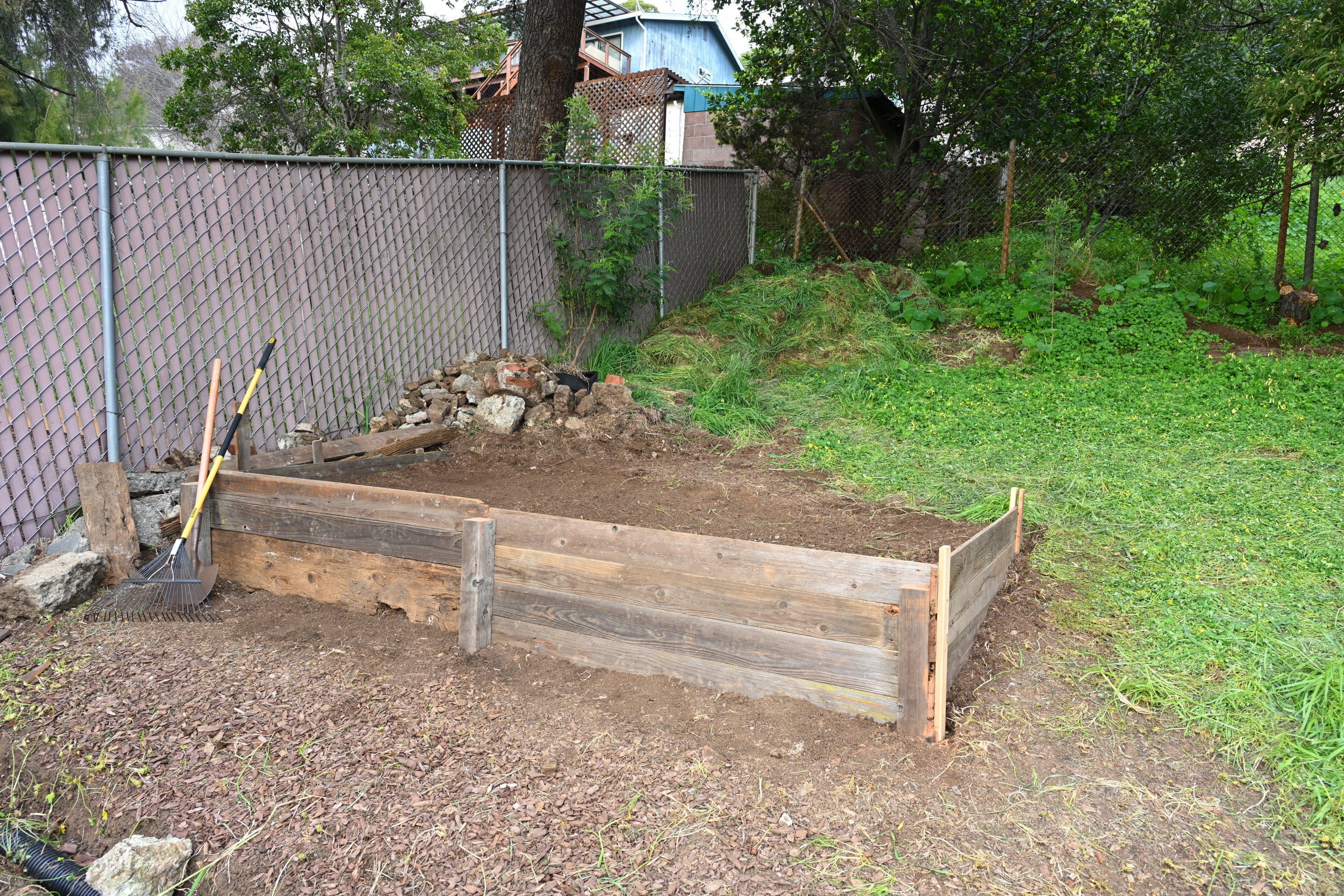 Completed first raised bed using mostly salvaged wood.