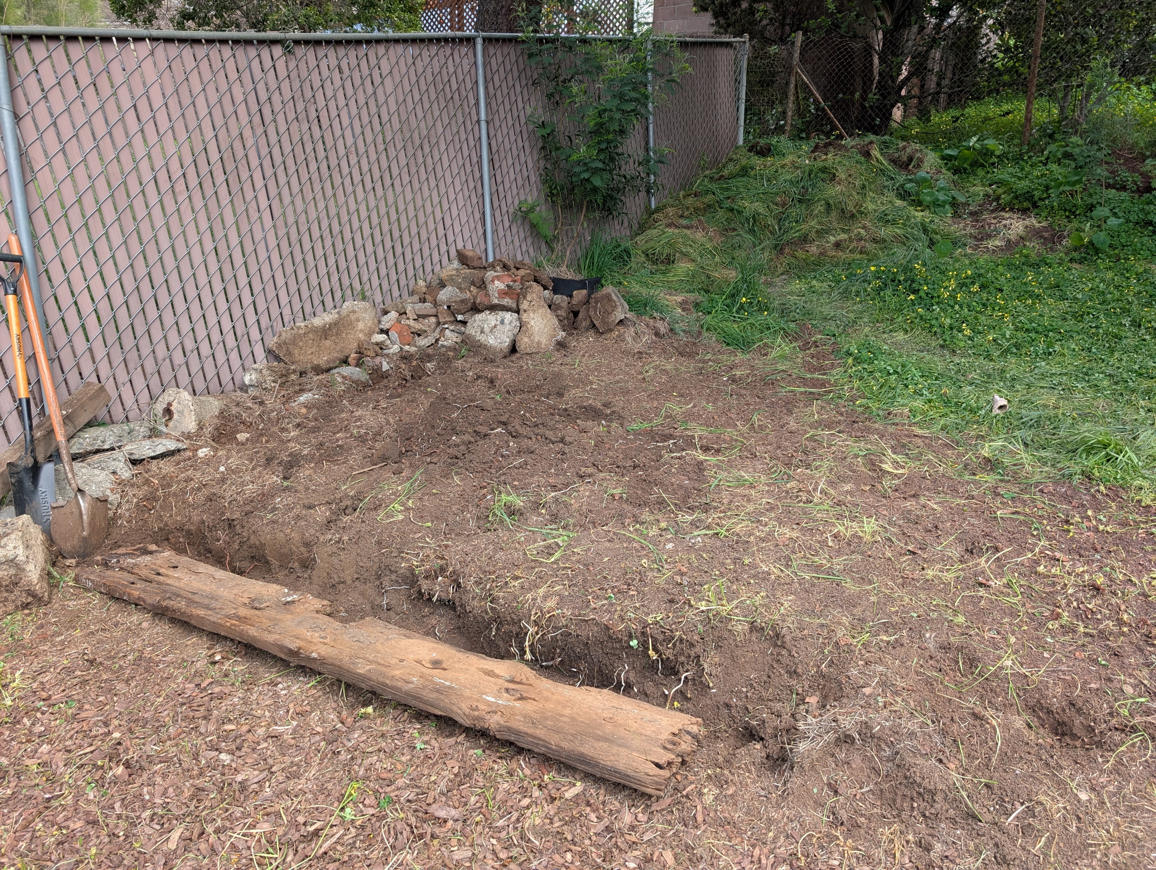 Raised garden bed build in progress.