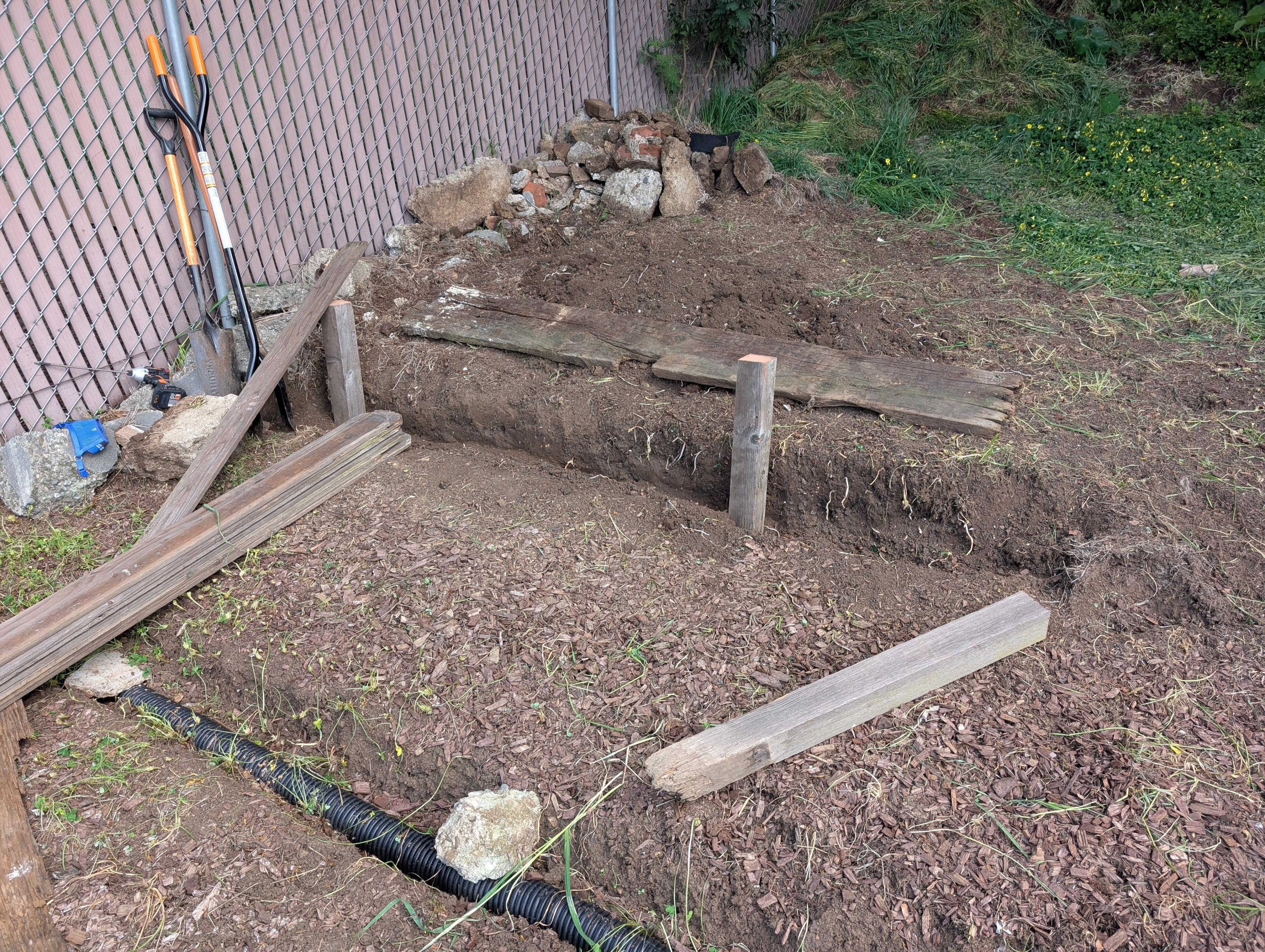 Raised garden bed build in progress.