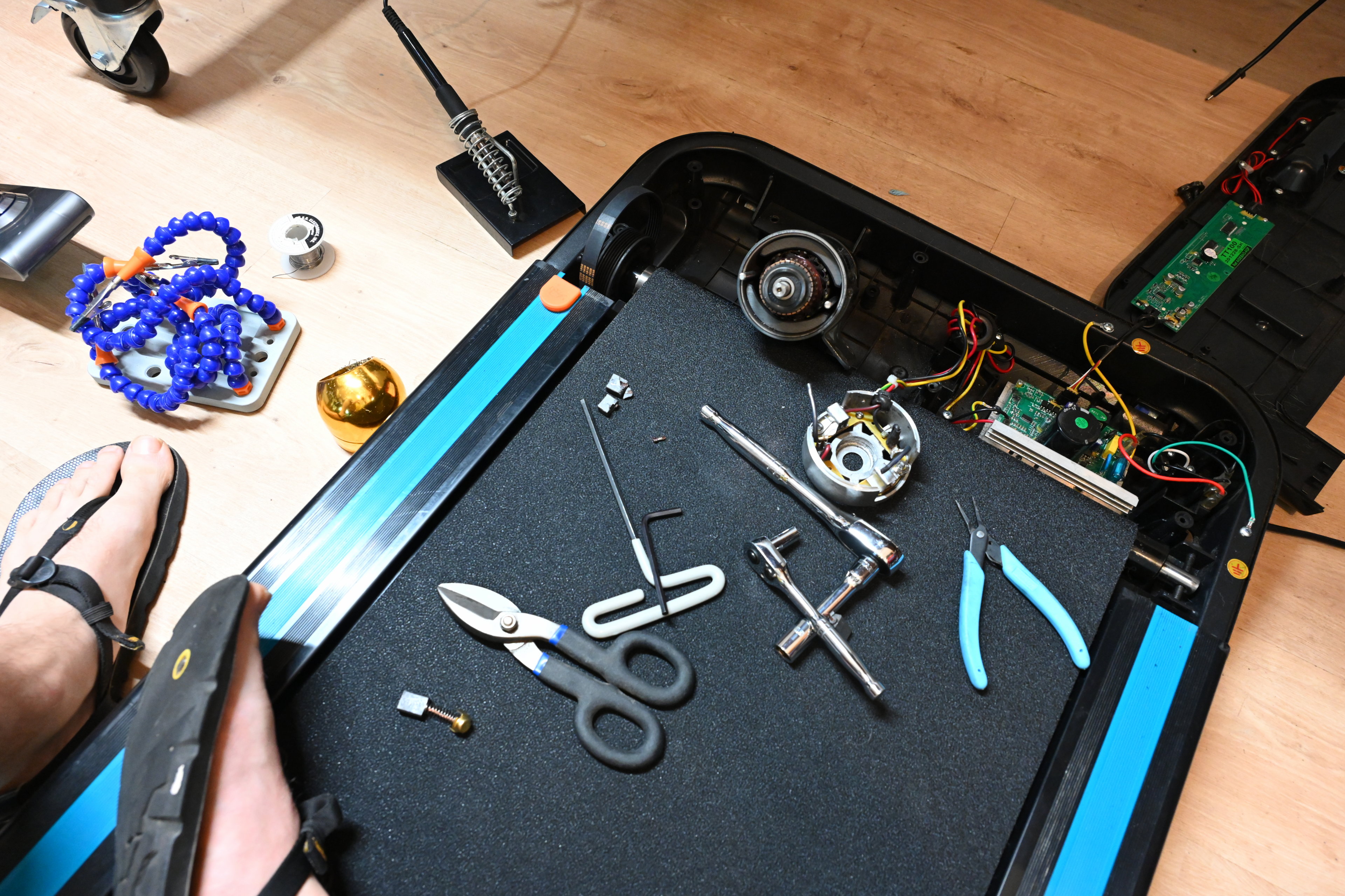 Repairing the treadmill again, this time to replace the graphite brushes and the belt again.
