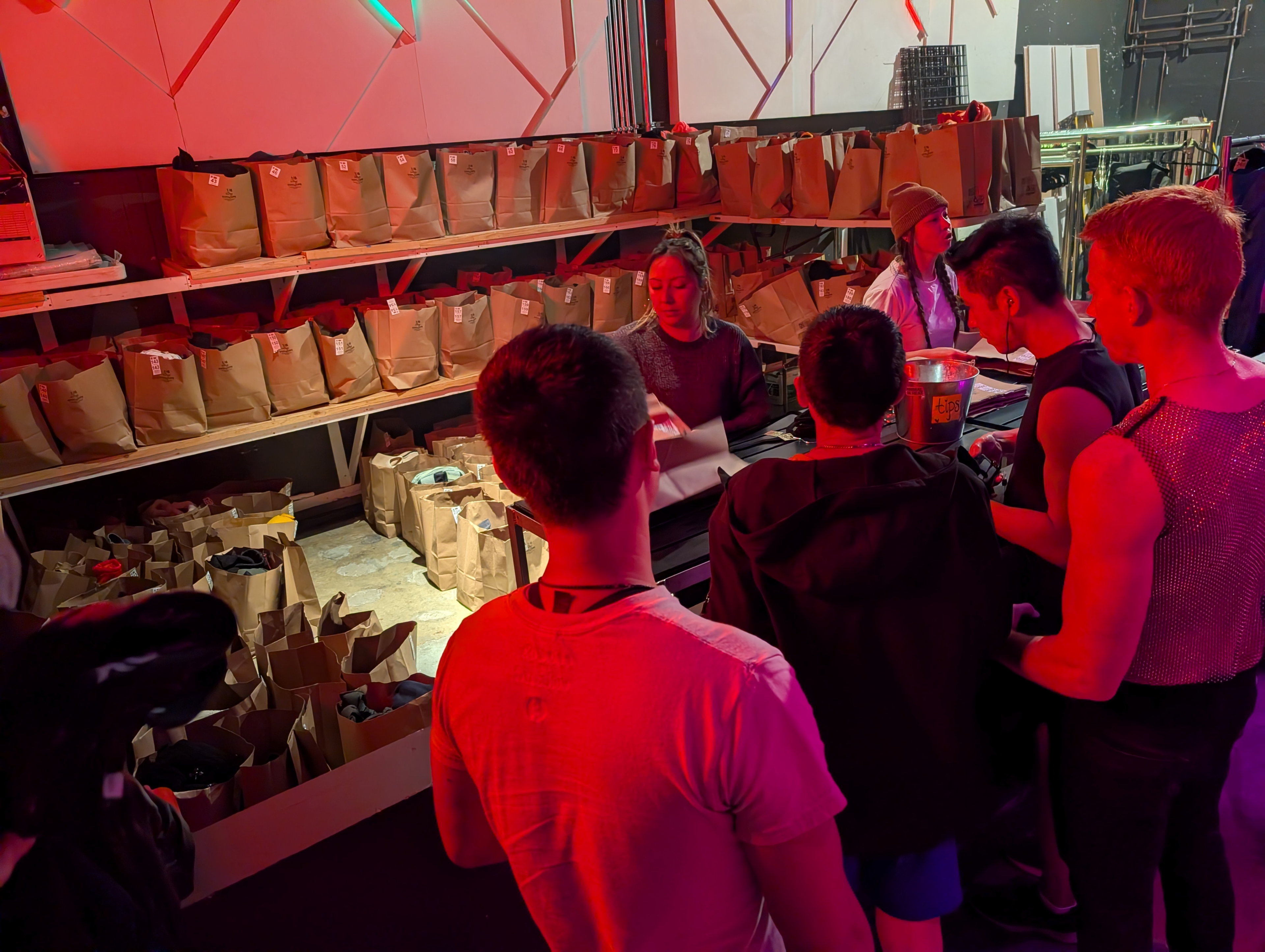 Electroluxx coat check at the Midway with paper bags