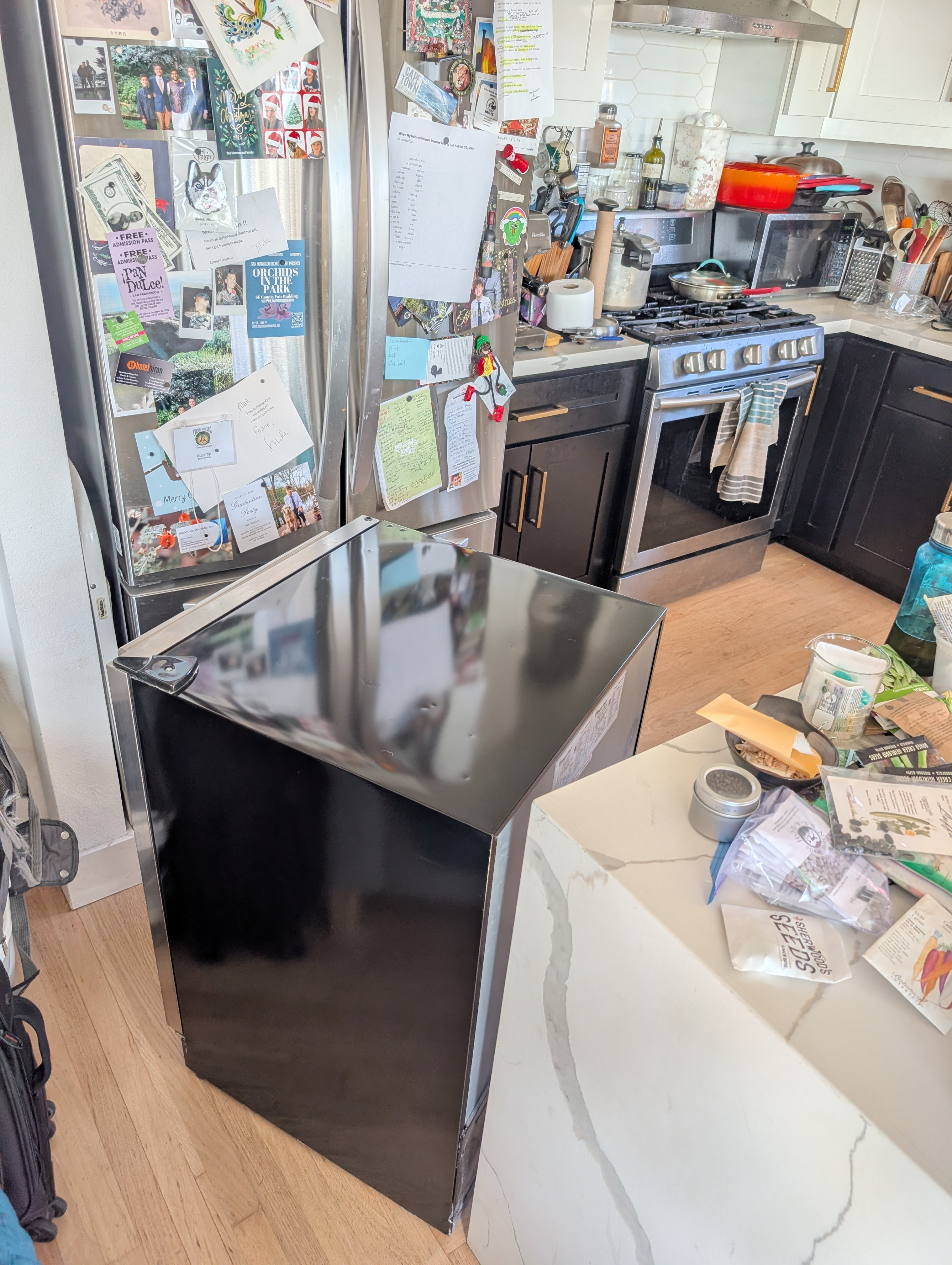 Derreck was inspired to want a wine cooler, and I volunteered to let him take ours. It's underutilized and we could use the space for food storage.
