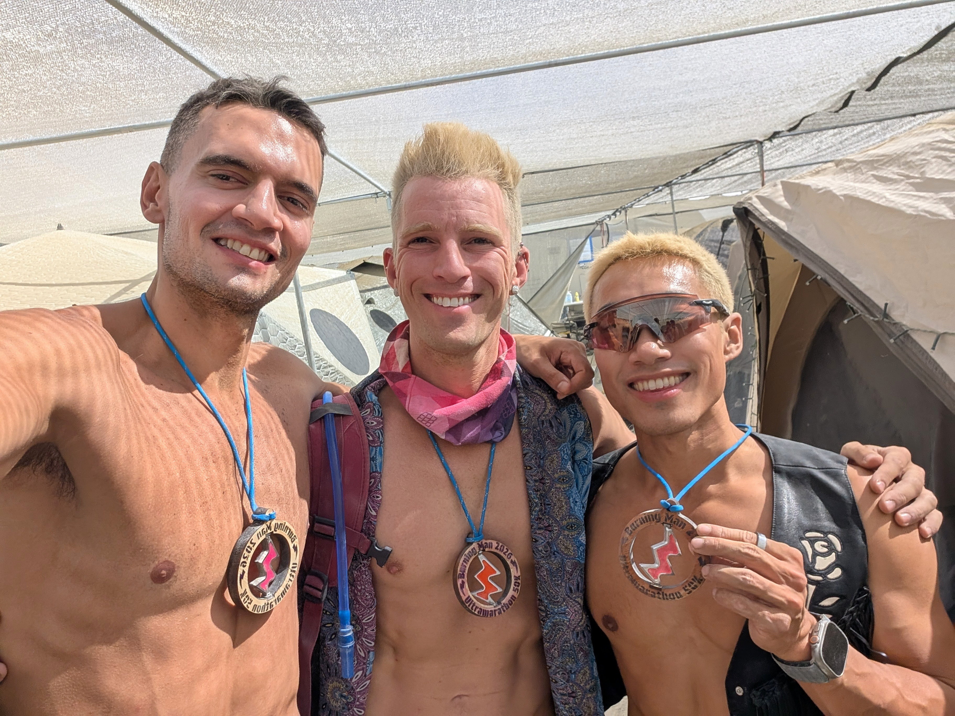 Randolph, me and Oscar after the Burning Man 50K with our beautiful medals!